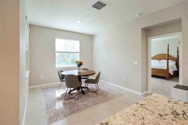 16926 Harvest Moon Way, Bradenton, FL 34211 - dining room with baseboards and light tile patterned floors