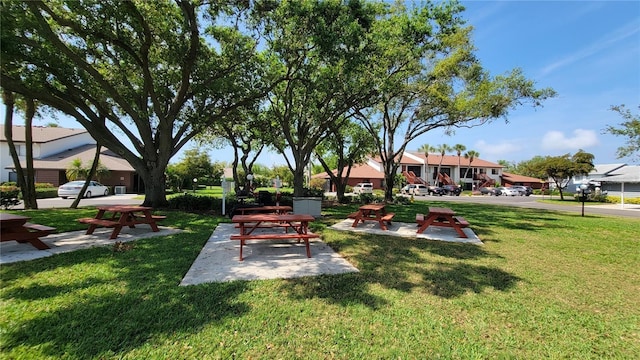 view of property's community with a yard