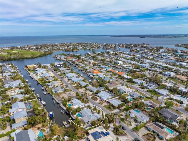 bird's eye view featuring a residential view and a water view