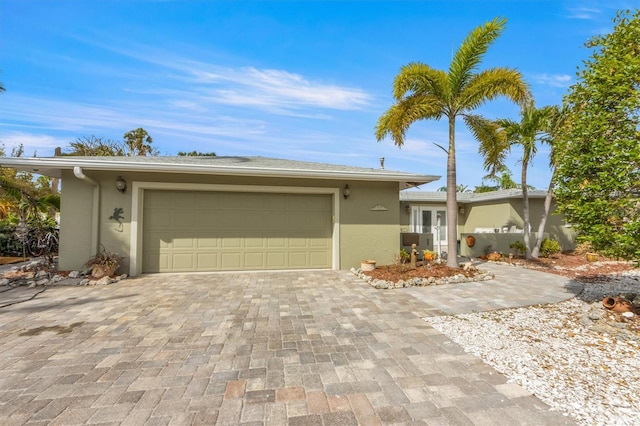 single story home featuring a garage