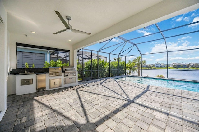 view of patio / terrace featuring area for grilling, ceiling fan, and a lanai