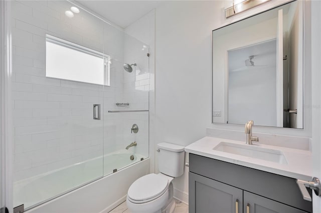 full bathroom with vanity, toilet, and shower / bath combination with glass door