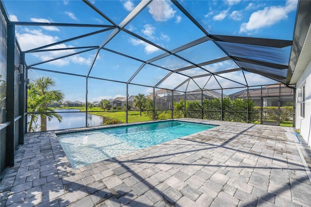 view of swimming pool with a water view, a patio area, and a lanai