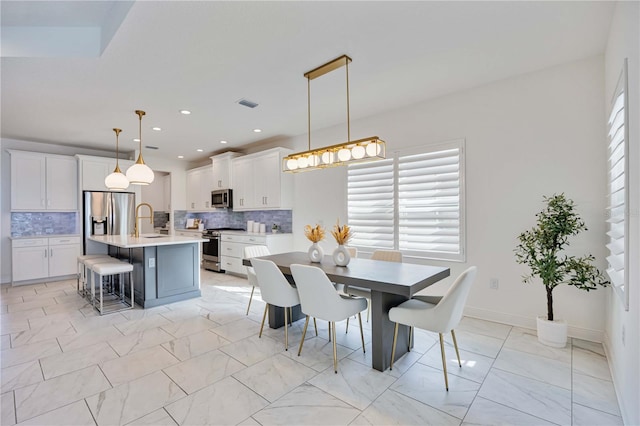 dining room featuring sink