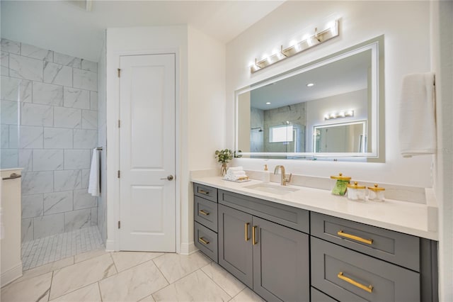 bathroom featuring vanity and a tile shower