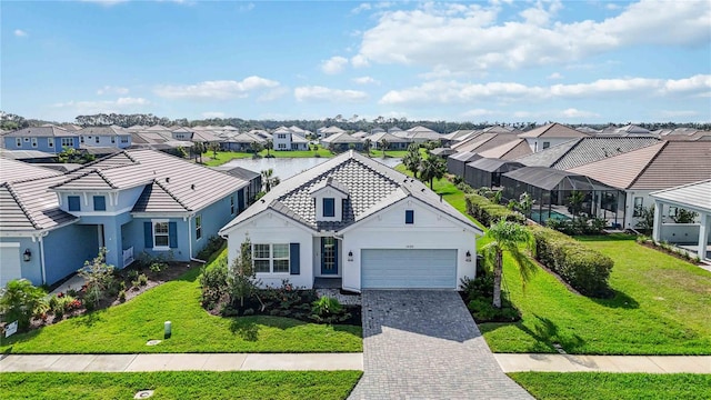 view of front of home featuring a front yard and a garage