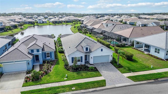 birds eye view of property with a water view