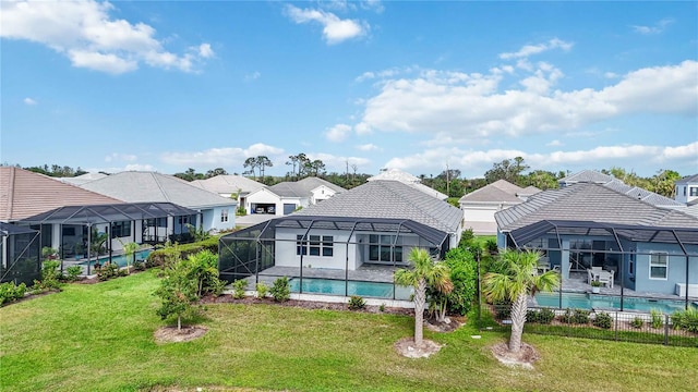 view of swimming pool with a yard and a lanai