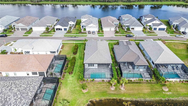 drone / aerial view with a water view