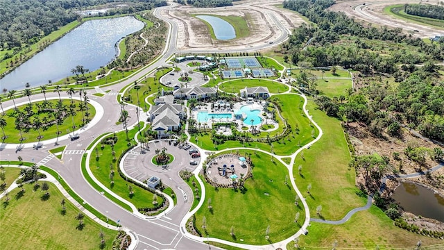 birds eye view of property with a water view