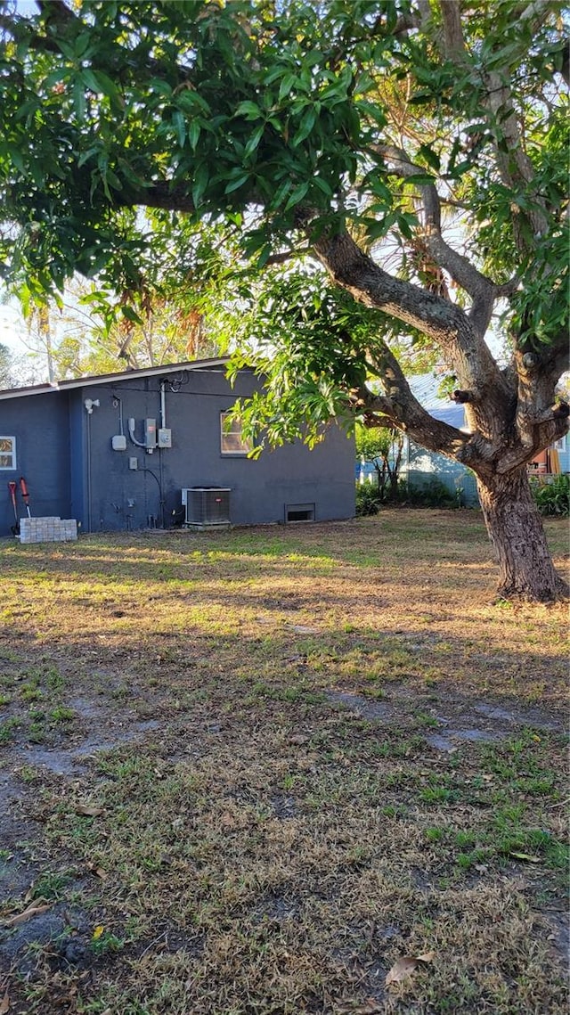 view of yard with central AC