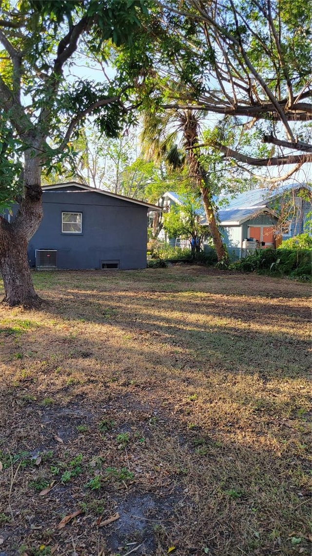 view of yard with central AC