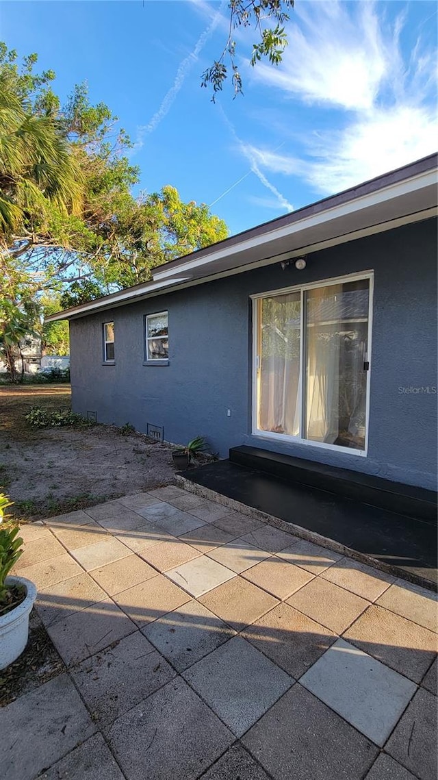 view of property exterior featuring a patio