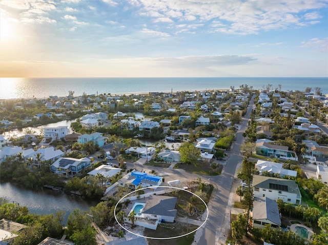 aerial view at dusk with a water view