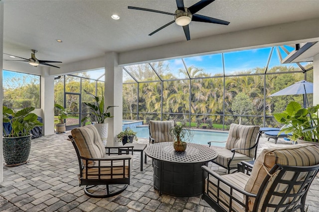 sunroom / solarium with ceiling fan