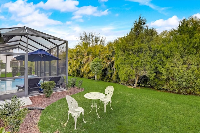 view of yard featuring glass enclosure