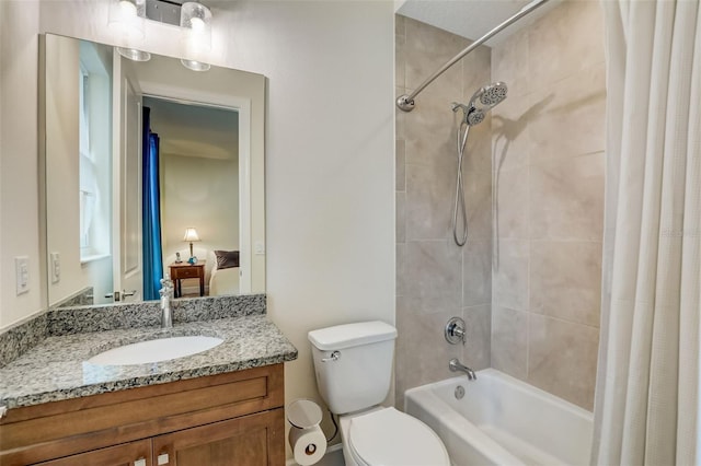 full bathroom featuring shower / bath combo with shower curtain, vanity, and toilet