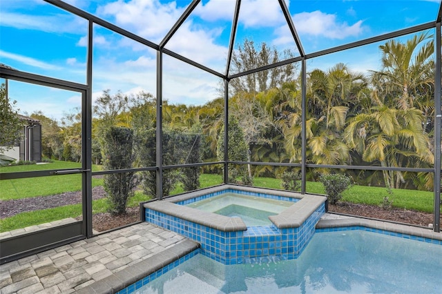 view of pool with a lanai and an in ground hot tub