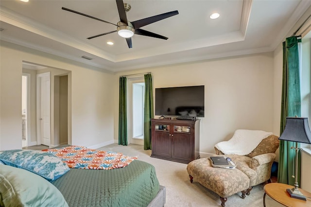 bedroom featuring a raised ceiling, ceiling fan, light colored carpet, and crown molding