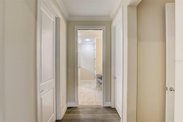 hall featuring dark hardwood / wood-style floors and ornamental molding