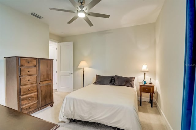 bedroom featuring ceiling fan and light carpet