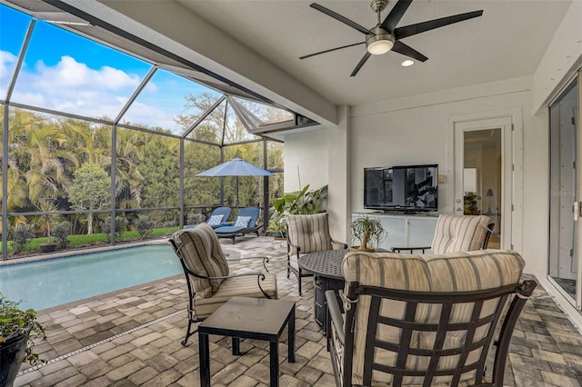 view of patio / terrace featuring ceiling fan and a lanai