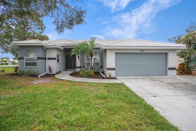 ranch-style house featuring an attached garage, concrete driveway, a tiled roof, stucco siding, and a front lawn