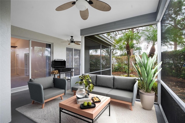 sunroom featuring ceiling fan