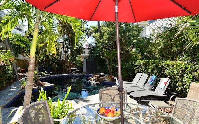 view of pool with a storage shed