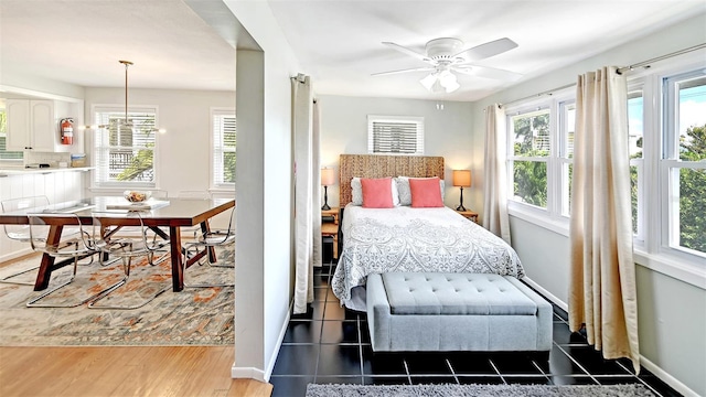 bedroom featuring ceiling fan and dark hardwood / wood-style flooring