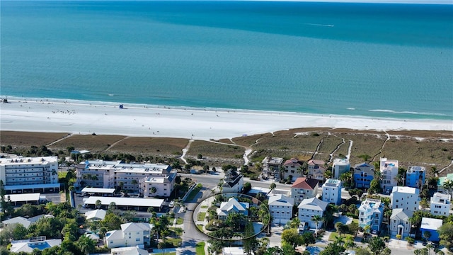 drone / aerial view featuring a view of the beach and a water view