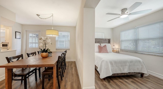 bedroom featuring ceiling fan and wood-type flooring