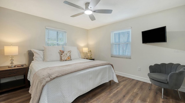 bedroom featuring dark hardwood / wood-style flooring and ceiling fan