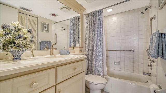 full bathroom featuring shower / bath combo, toilet, and vanity