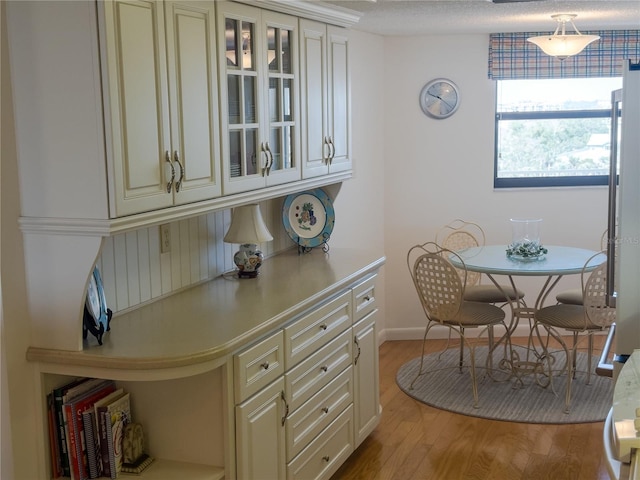 dining area featuring light wood-style flooring