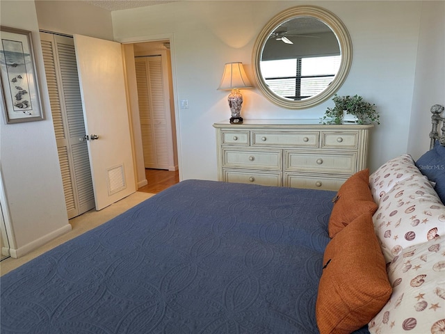bedroom with baseboards, carpet, and visible vents