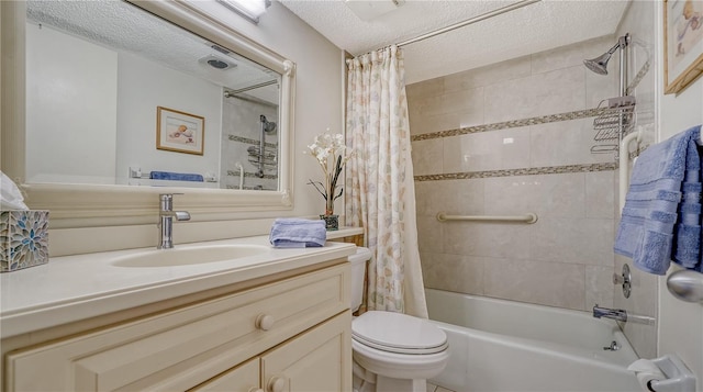 full bathroom with vanity, shower / tub combo with curtain, a textured ceiling, and toilet