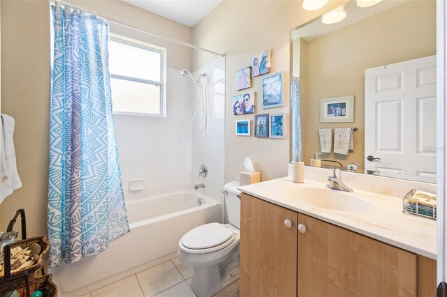 full bathroom featuring tile patterned floors, vanity, toilet, and shower / tub combo