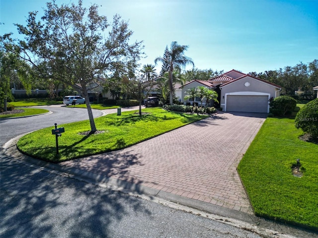 view of front of house with a garage and a front yard