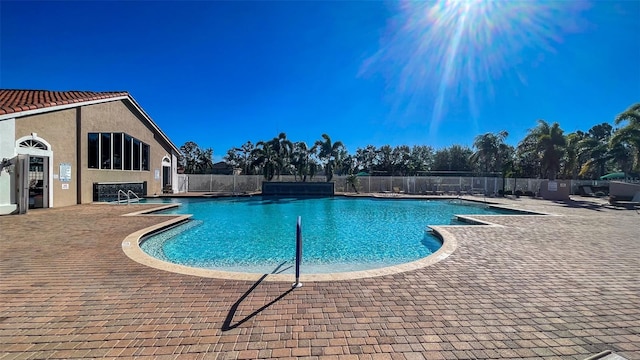 view of swimming pool with a patio