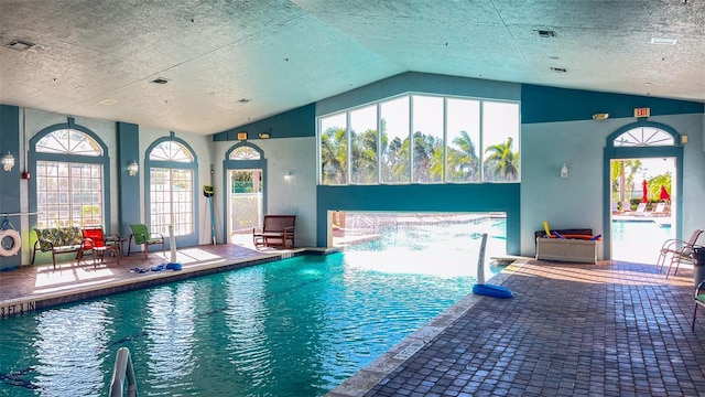 view of swimming pool with pool water feature