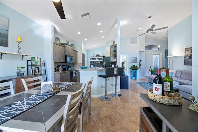 dining area with french doors and ceiling fan