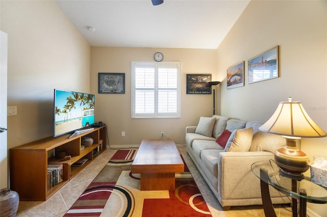 living room featuring lofted ceiling