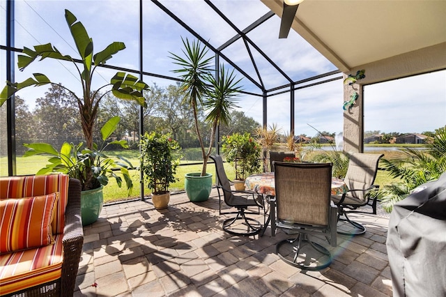 view of patio / terrace featuring glass enclosure and grilling area