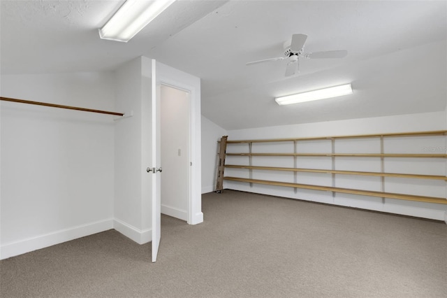 additional living space with ceiling fan, carpet floors, and vaulted ceiling