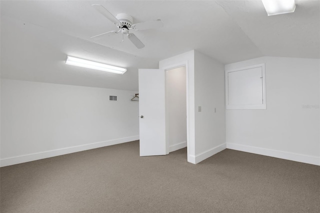 additional living space with ceiling fan, carpet floors, and vaulted ceiling