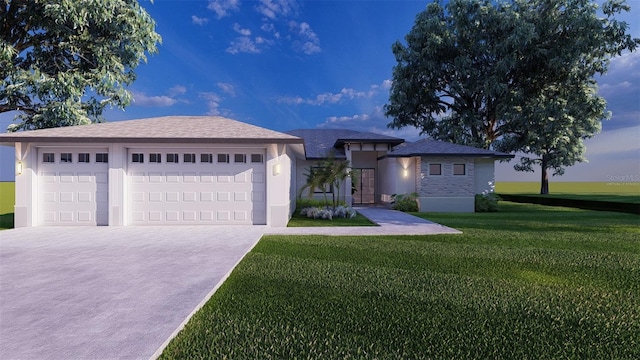 view of front facade with a garage and a front lawn