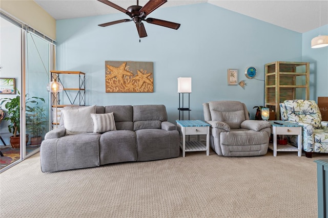 living room with ceiling fan, carpet floors, and lofted ceiling