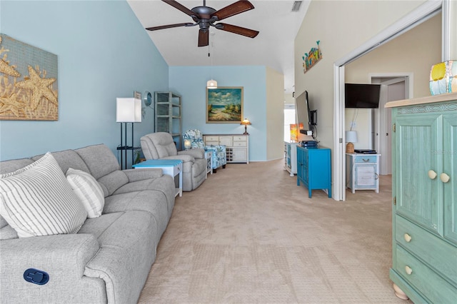 carpeted living room with high vaulted ceiling and ceiling fan