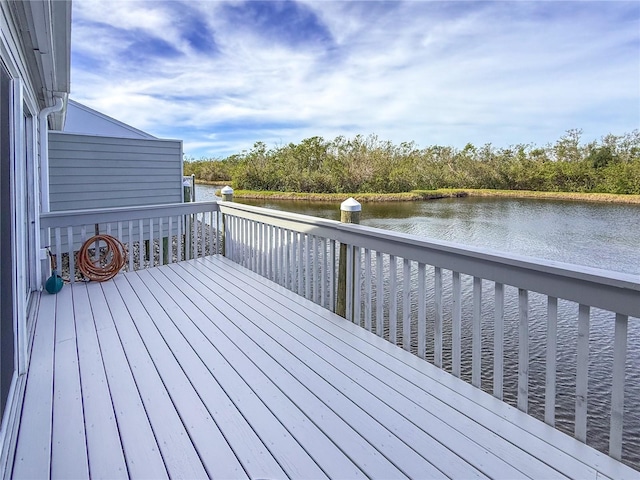 wooden terrace featuring a water view